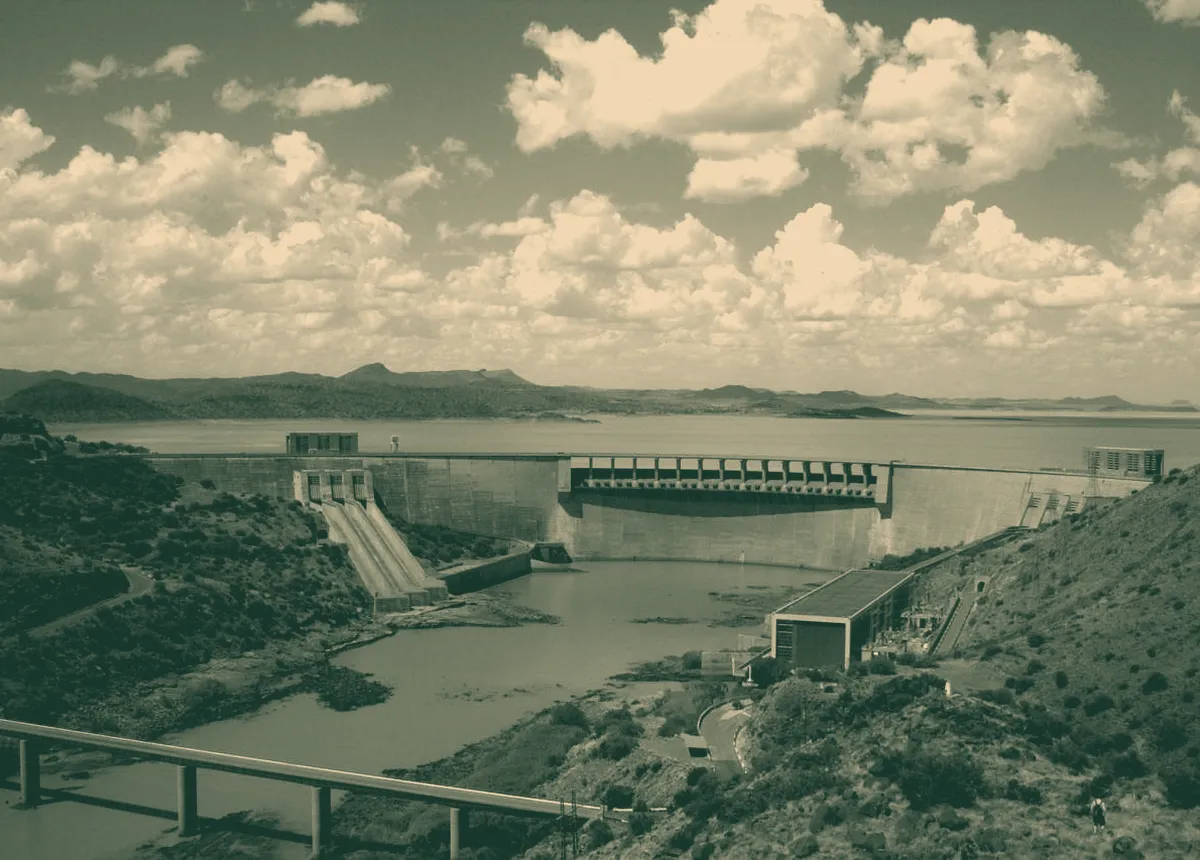 A large dam wall holding back a reservoir.